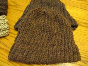 4-strand yarn in shades of brown.  E-wrapped knitted on a round knitting loom.